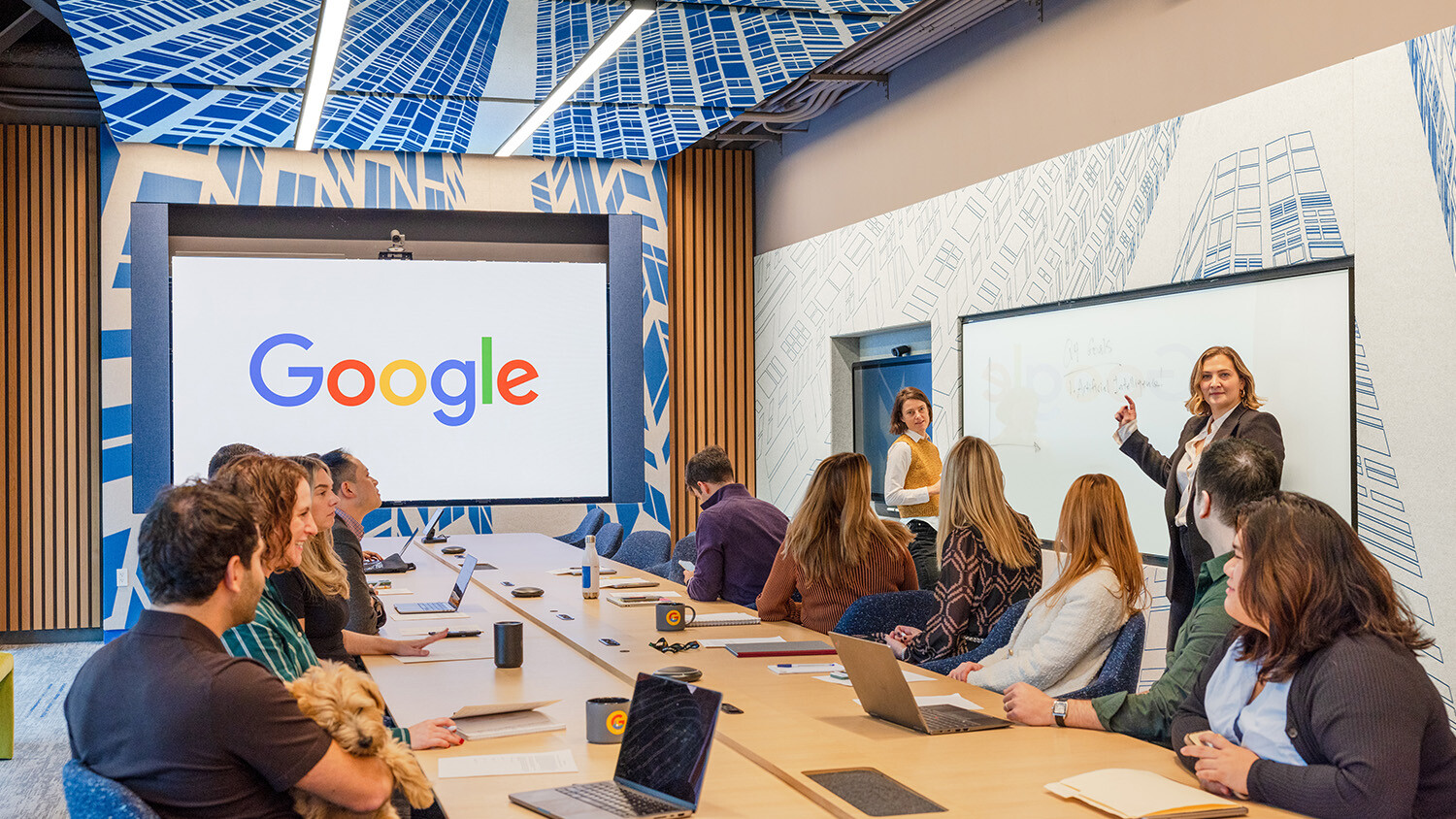 Google employees having large meeting in conference room